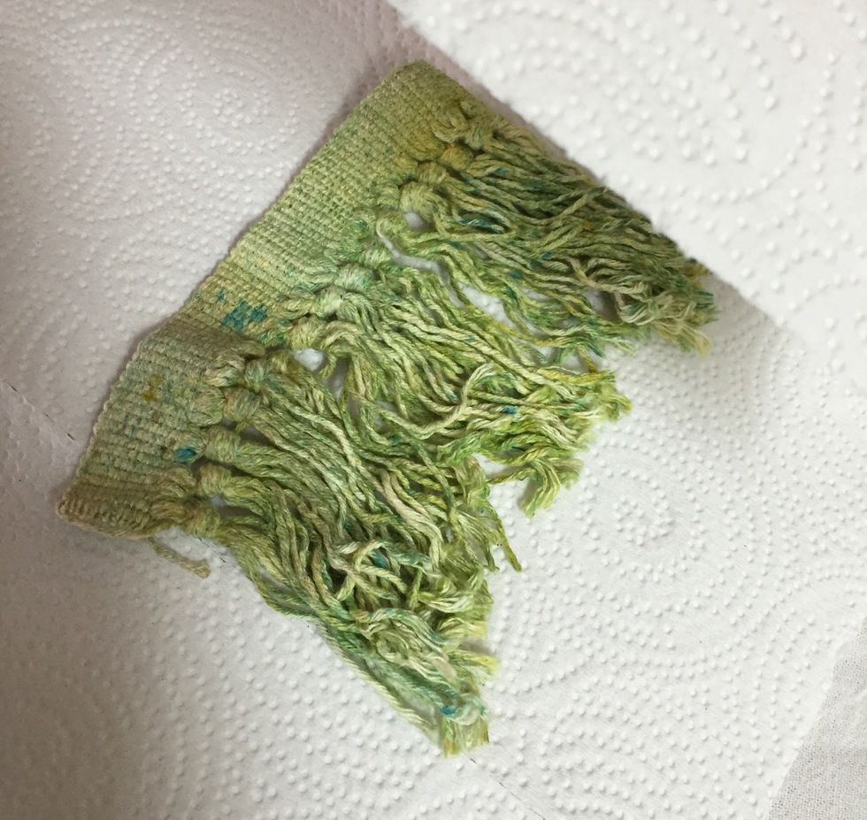 place fringe between clean paper towels and iron to heat set and dry inks.