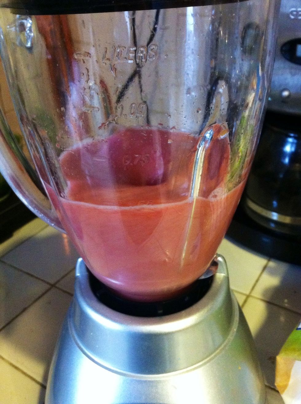 Place frozen (or fresh) fruit in blender. Add pomegranate juice (or any fruit juice you prefer) and water. Now blend!