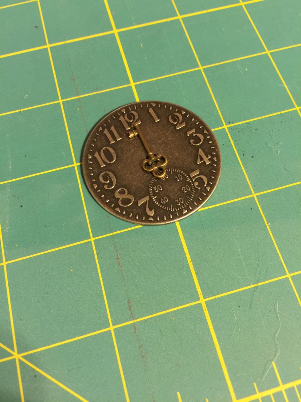 Place glue side down onto the clock at whatever time you desire.