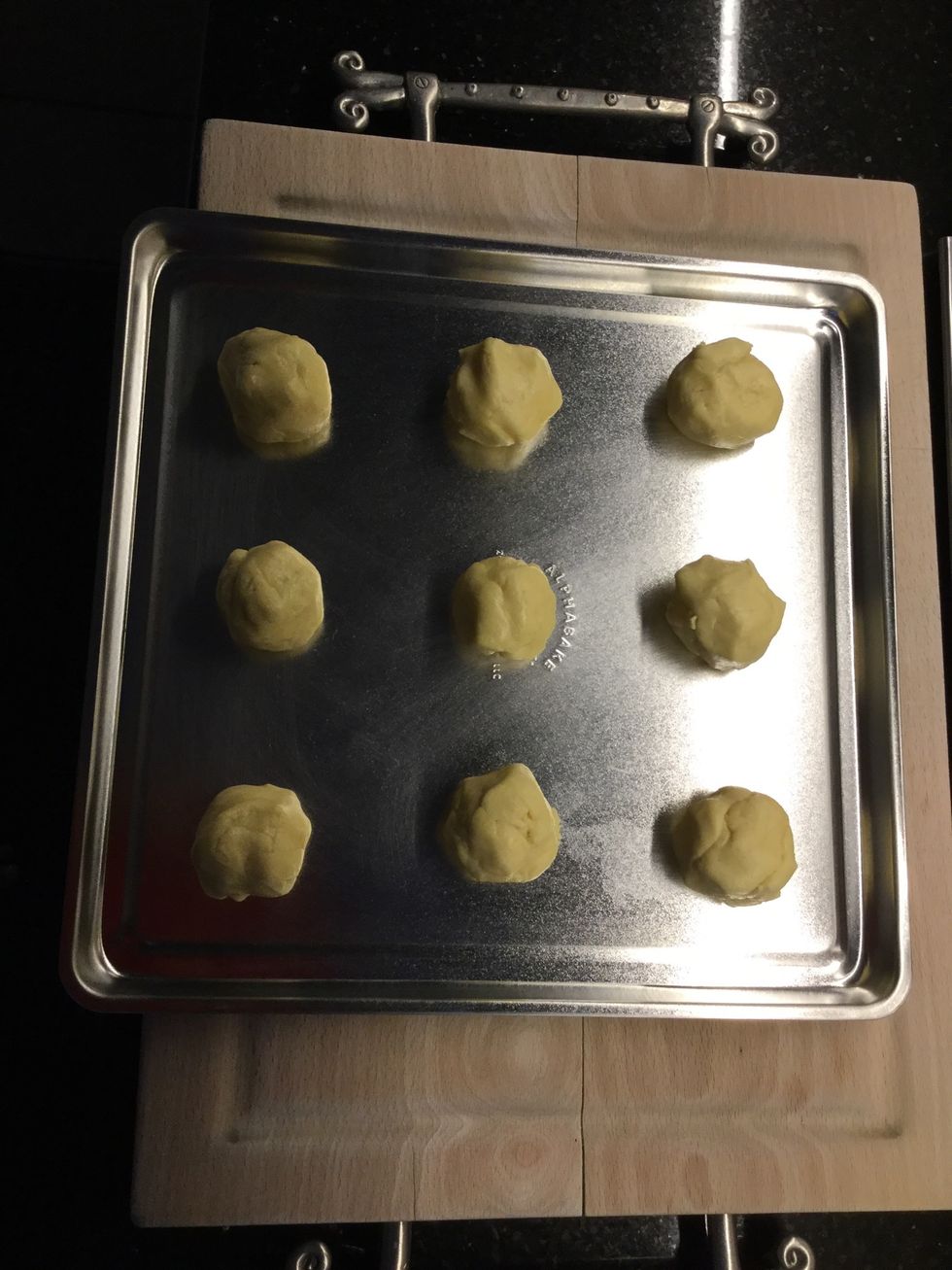 Place golfball size balls on a baking tray 2 inches apart
