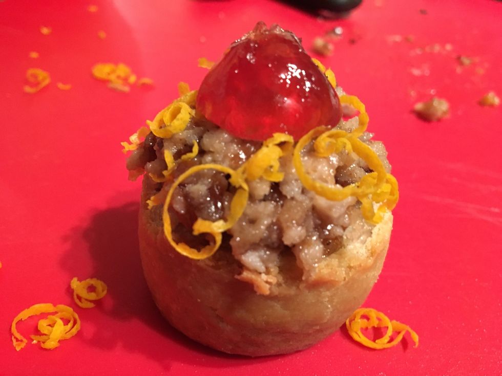 Place half of a glac\u00e9 cherry on top