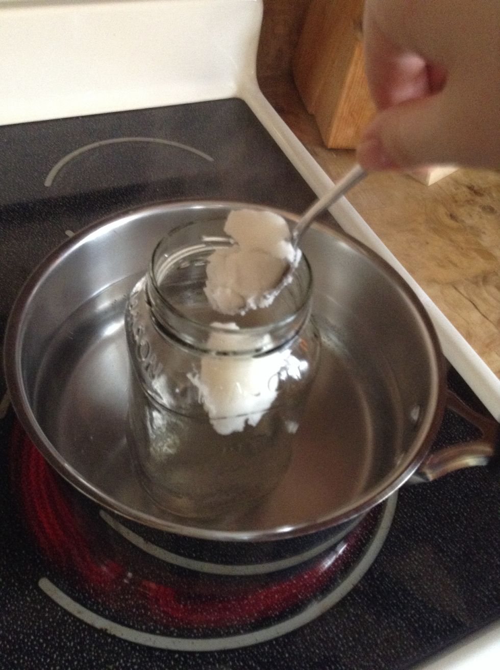 Place half tablespoon of coconut oil in jar