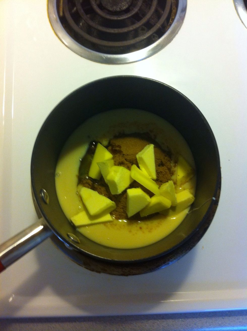 Place half the condensed milk, sugar, glucose syrup, golden syrup and butter in a heavy based saucepan over low heat.