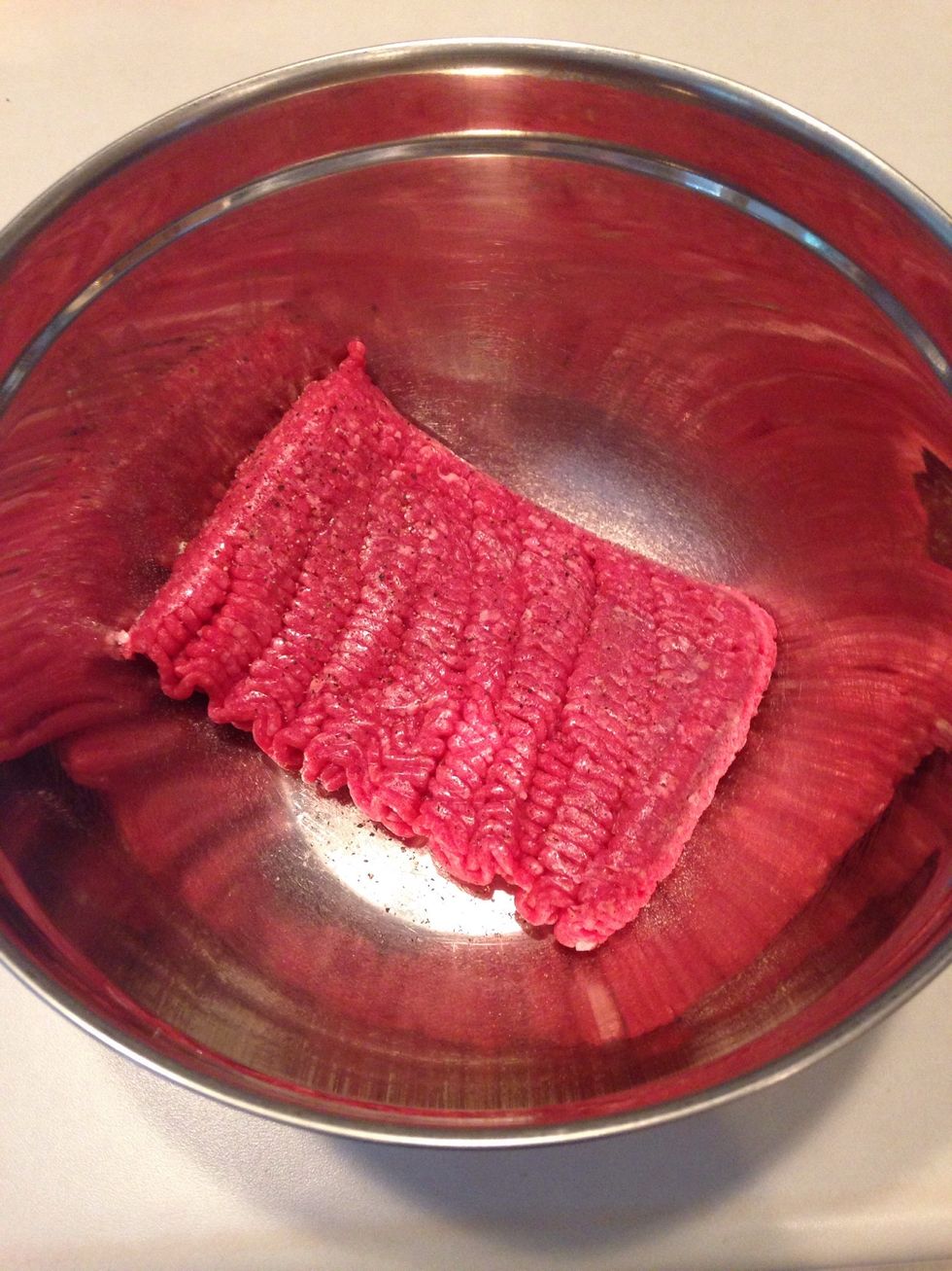 Place hamburger meat in large mixing bowl.
