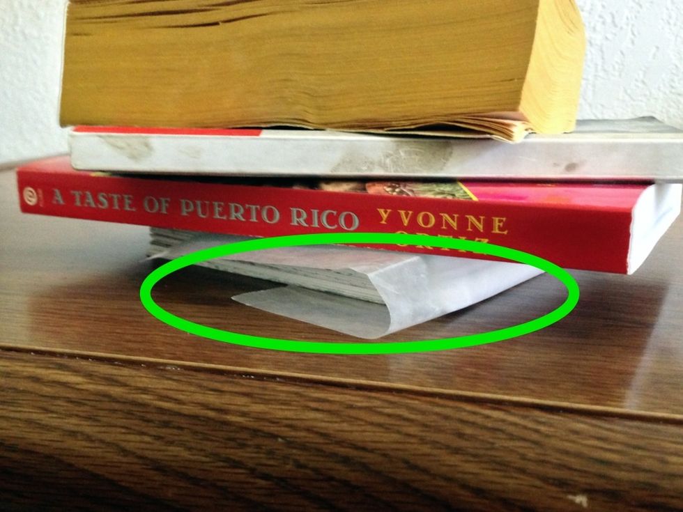 Place heavy objects on top and leave them there overnight or for a few hours.
