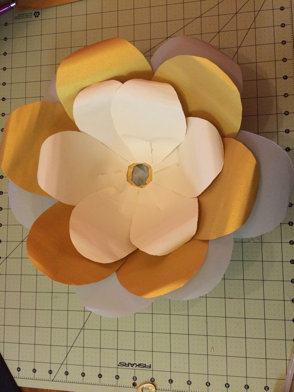 Place hot glue inside of the large petal bowl and insert the medium petal bowl and insert the small bowl the same way