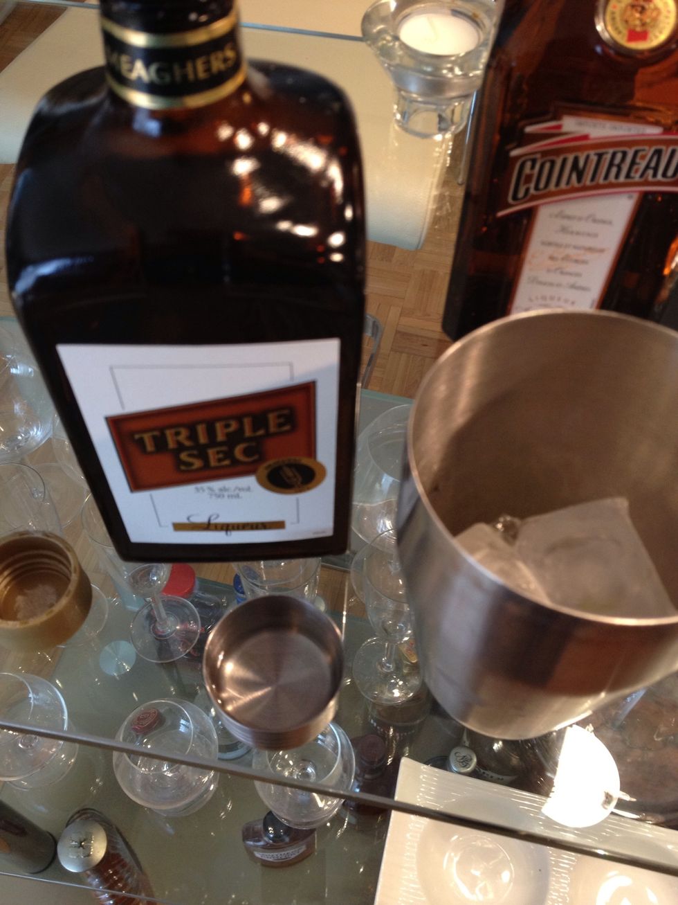 Place ice into the shaker and start adding your ingredients. 1/2 part triple sec