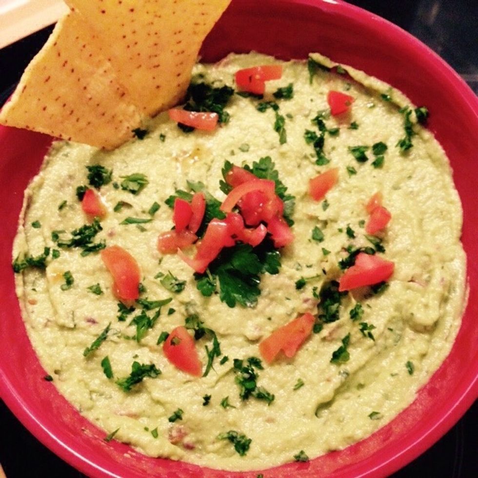 Place in a bowl and garnish with some parsley and tomatoes. Serve with corn tortillas. Enjoy!