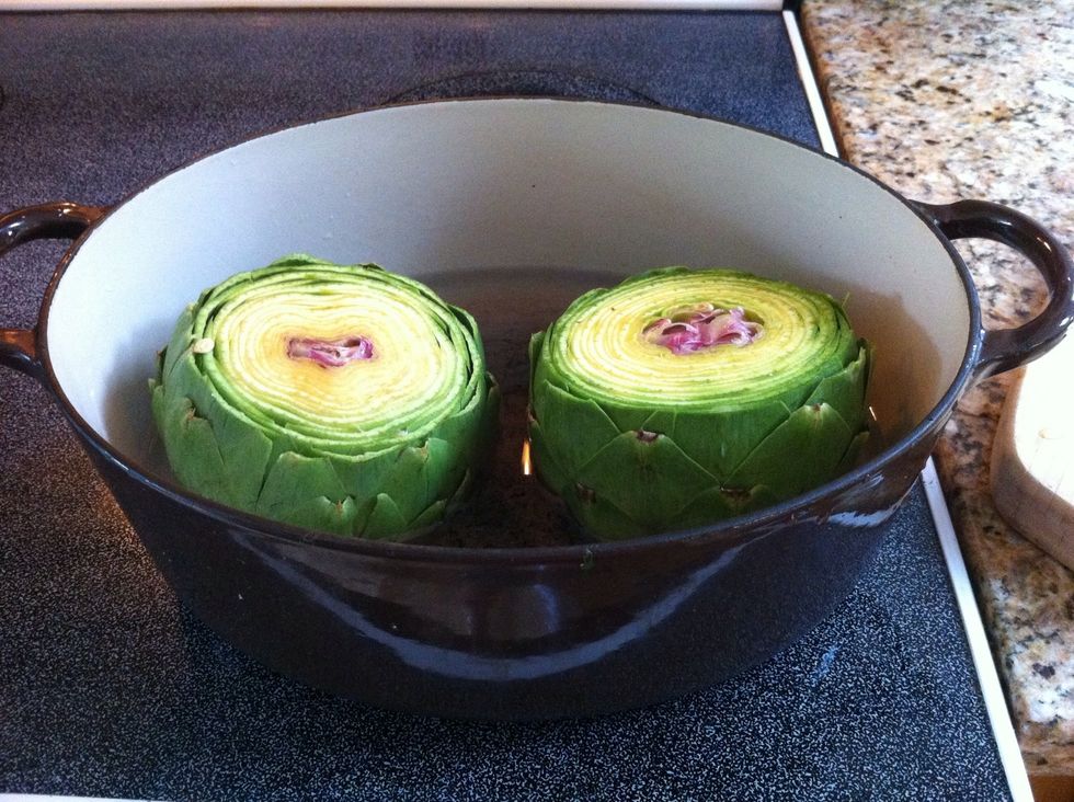 Place in a covered pot with a steamer basket and a few inches of water. Boil gently for up to an hour until a knife can be inserted in the stem end. Add water as needed to keep pan from becoming dry.