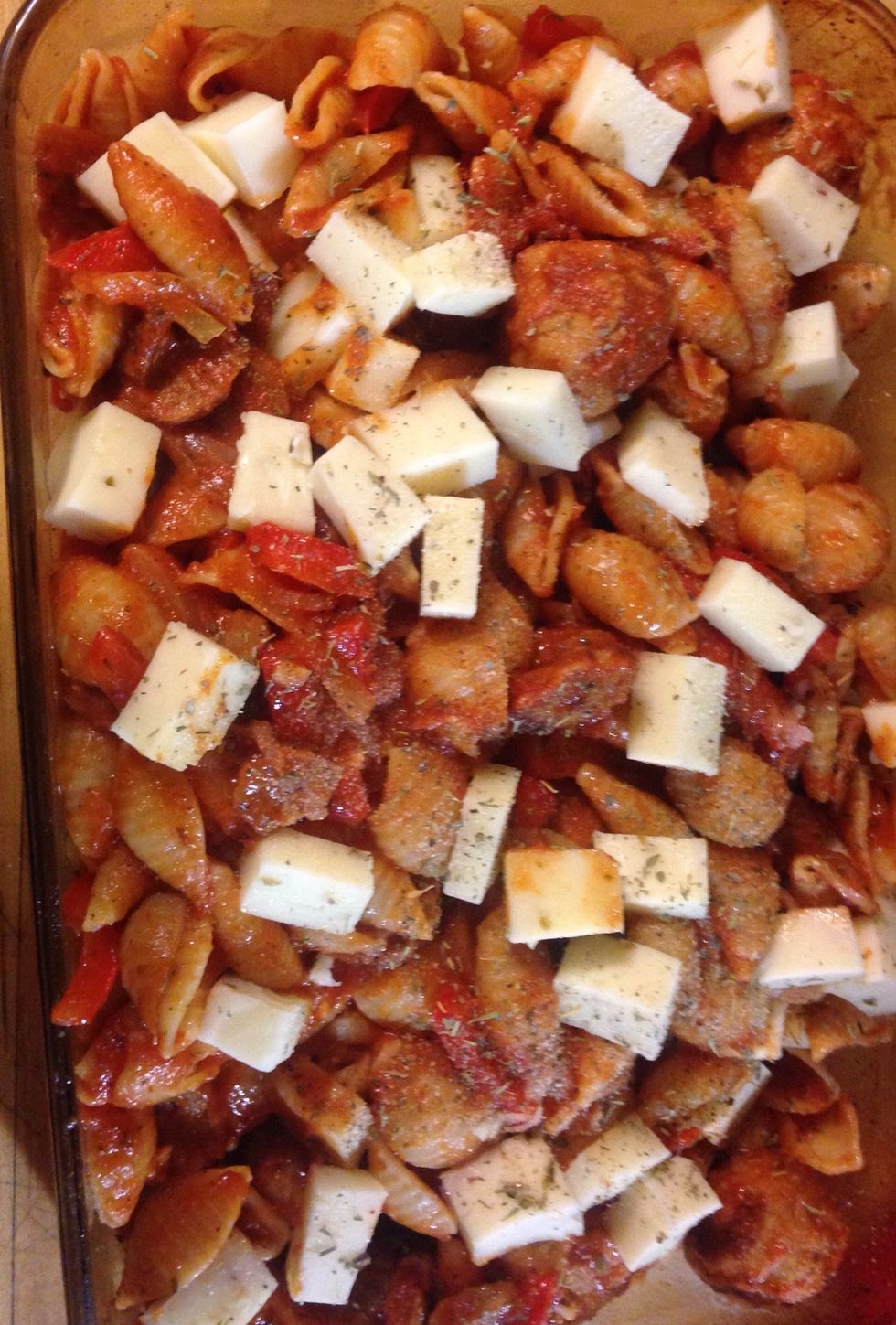 Place in a lasagna pan spray with olive oil first . Layer with cheeses of your choice. I choose mozzarella and white cheddar
