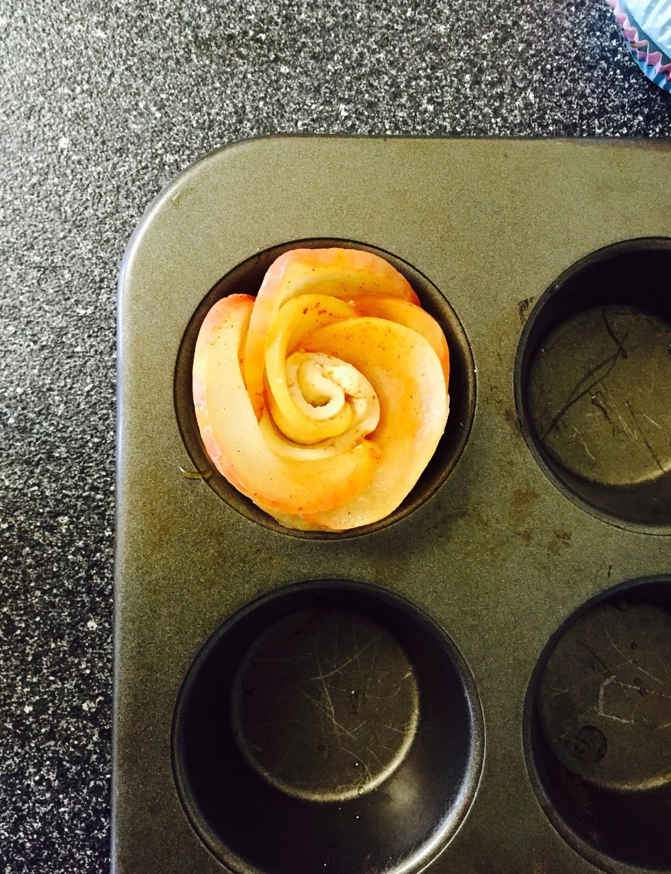 Place in a lightly greased cupcake tin. Once all 6 roses are rolled place in oven for approximately 40 minutes.