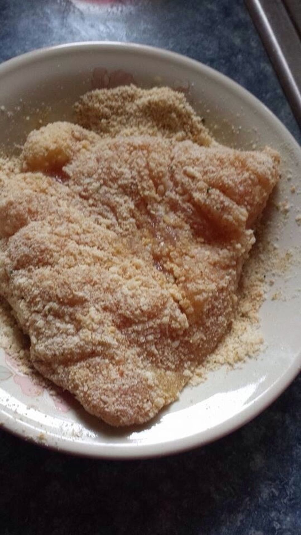 Place in Italian seasoning/grated Parmesan cheese mix, pressing down to coat well.