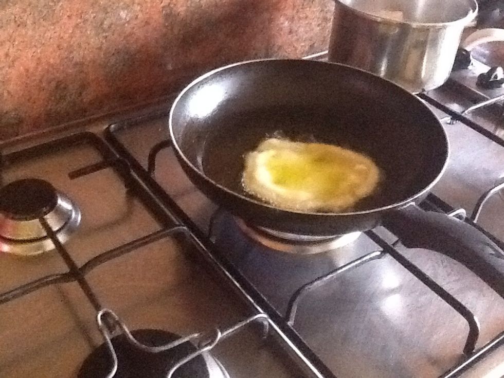 Place in pan filled with vegetable oil until it goes semi-hard on one side, then flip it