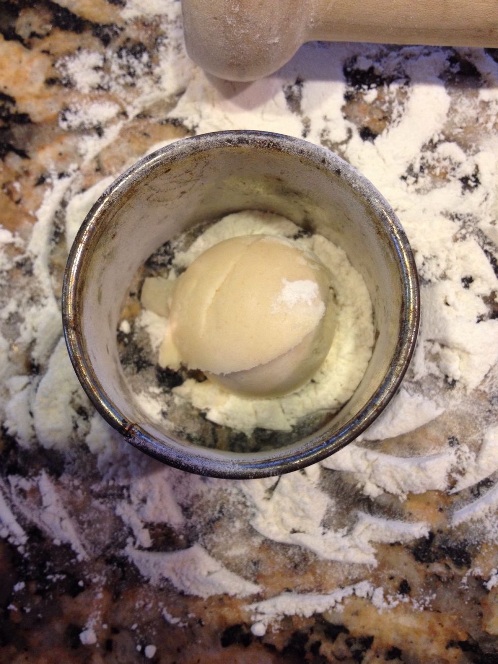 Place inside your cookie round cutter. Dough should be round side up