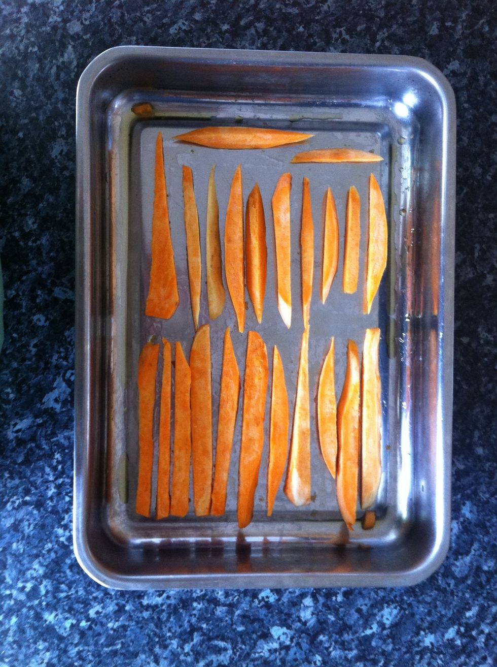 Place into a baking tray and sprinkle with oil before lining them up. If you want to add any herbs (rosemary is especially complimenting) do so now.