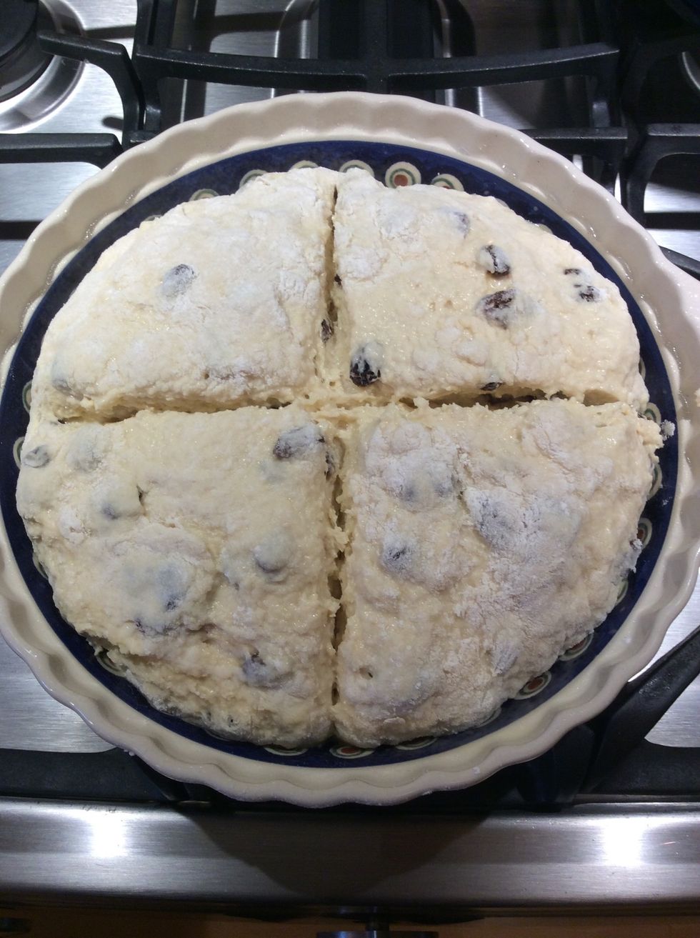 Place into baking dish. Using a sharp knife score deeply across the dough.