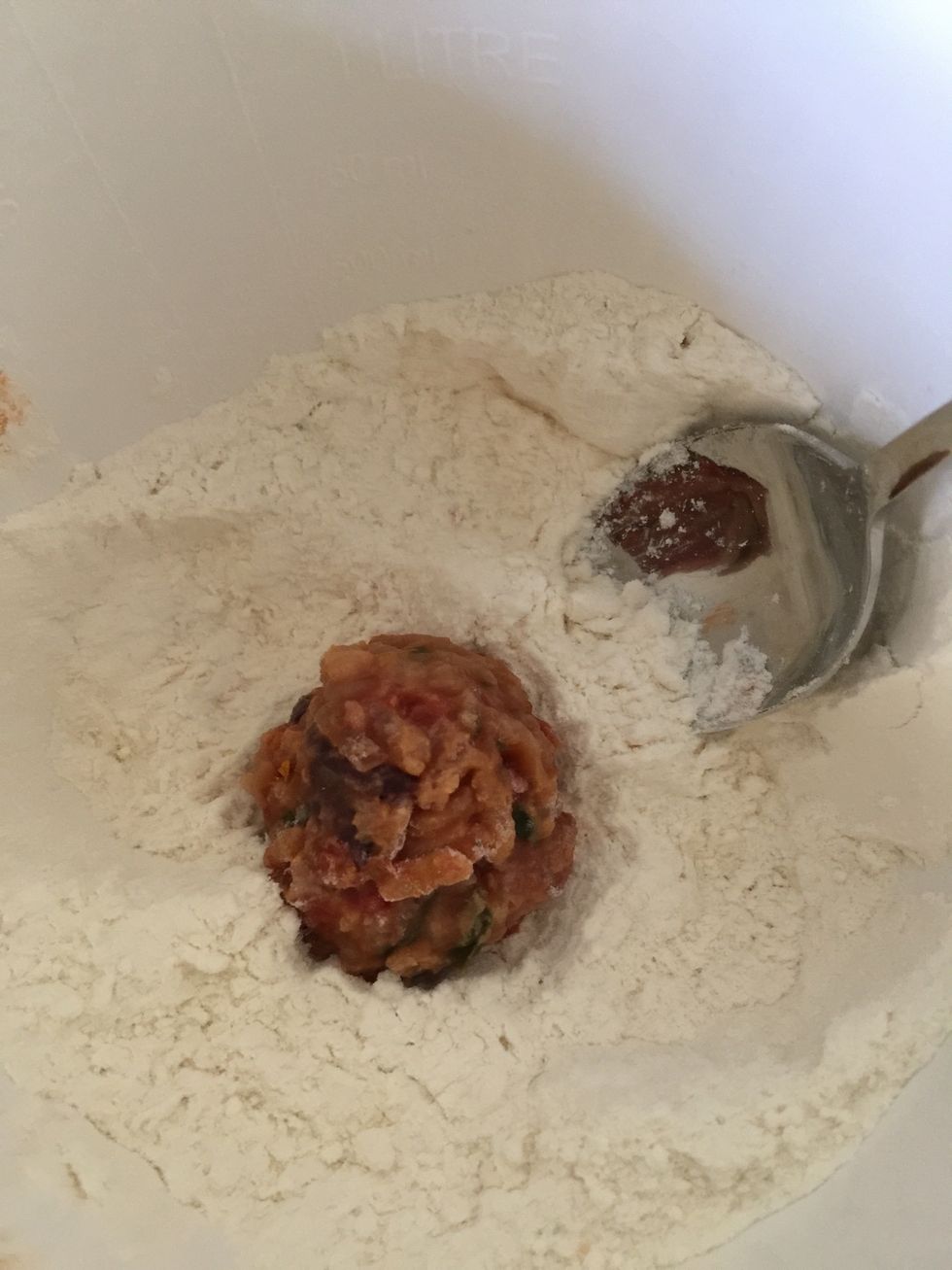 Place into flour. Coat well and shake off excess.