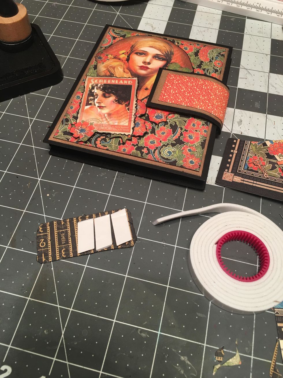 Place it a bit over the stamp image to get the placement for your adhesives. Apply foam tape to the right back side as shown.