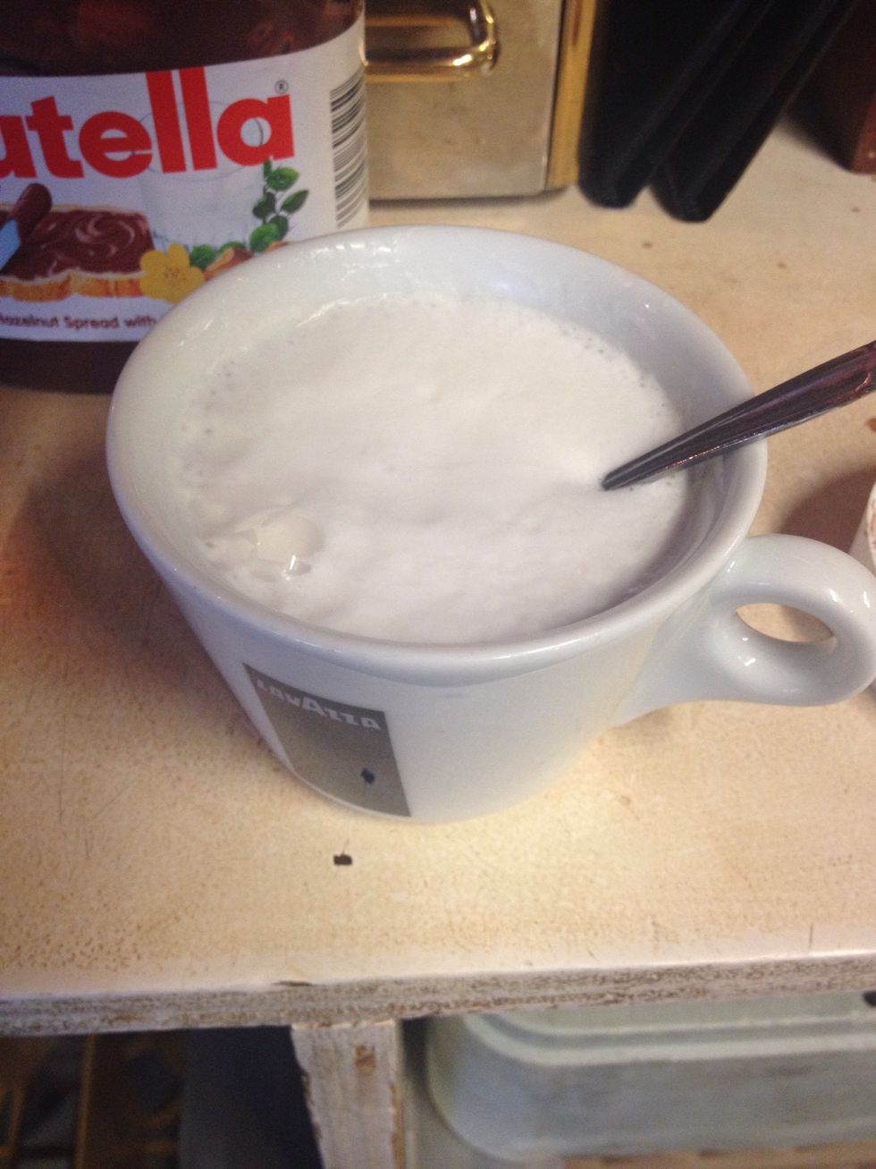 Place it in the cup and let it sit for a few seconds so it melts a little