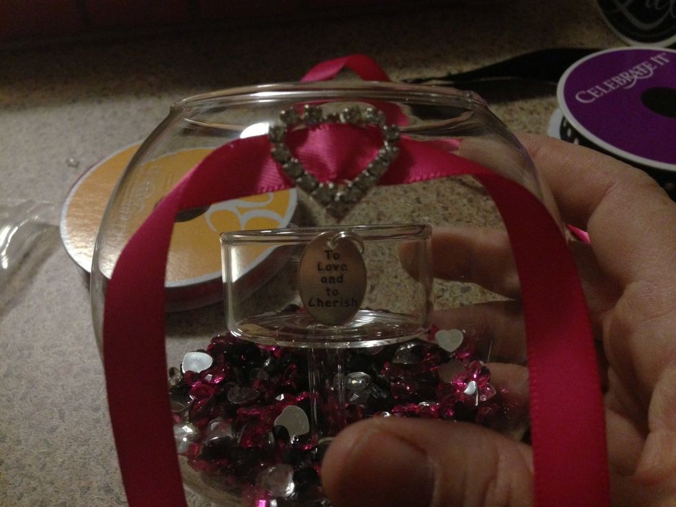 Place it near the top of the outer most glass exactly centred and above your poem. You don't want to cover it up.
