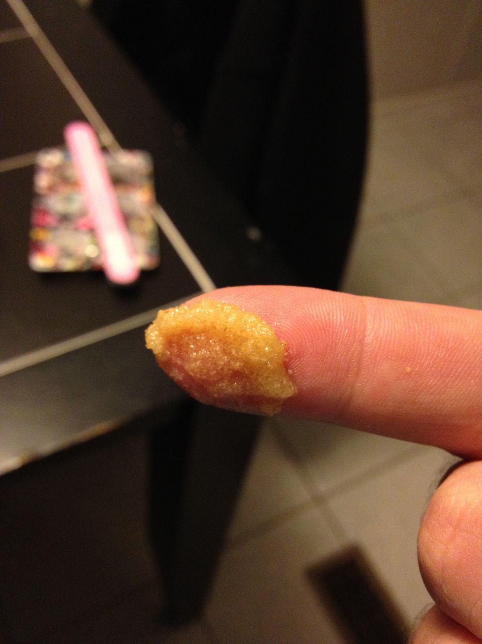 Place it on a cotton swab or clean your hands and use your finger