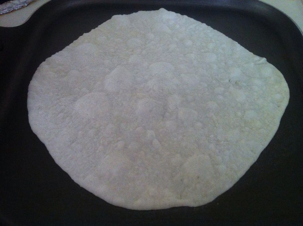 Place it on it skillet and let it cook for 1 min. Then turn it to other side.