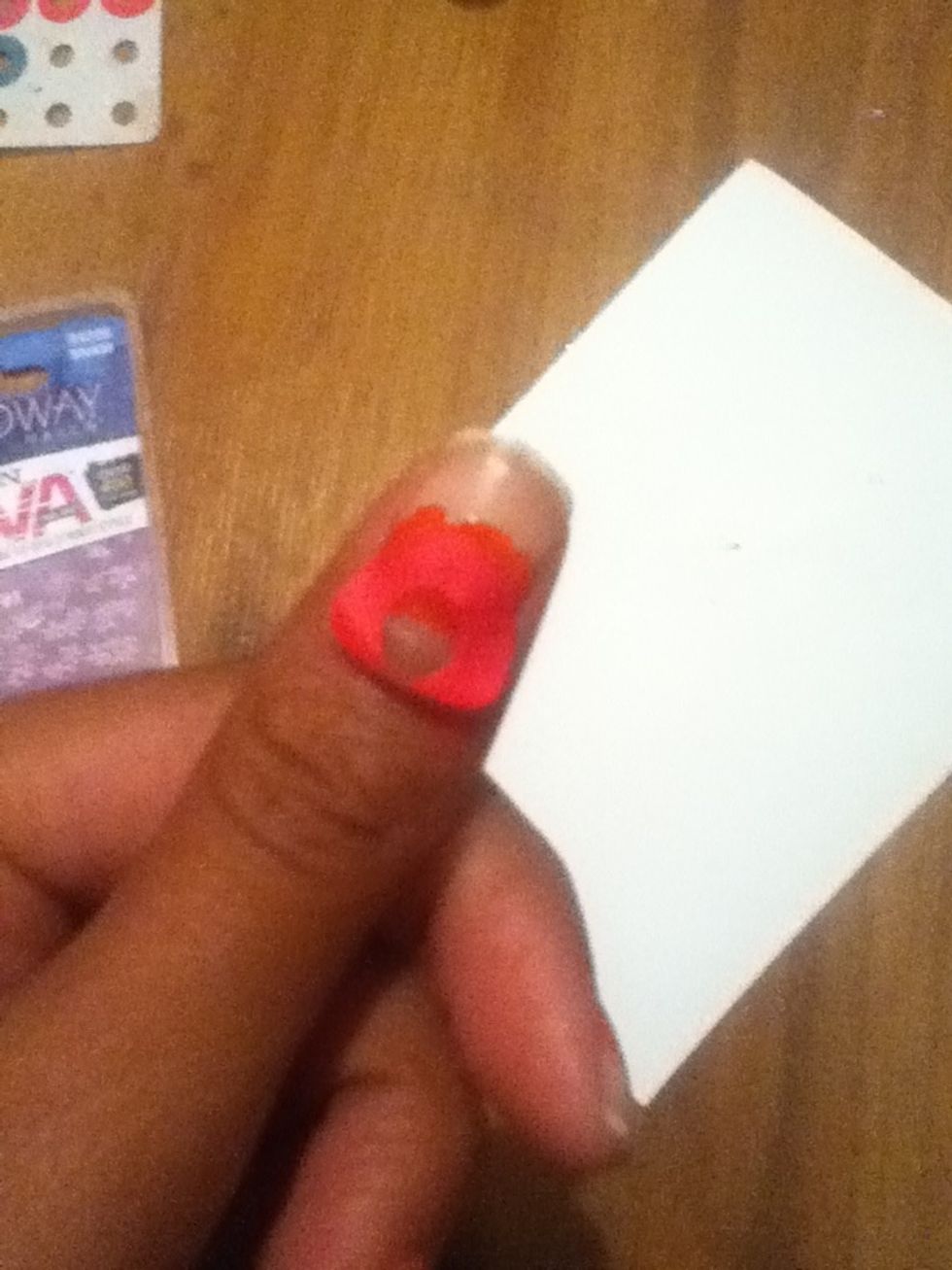 Place it on the bottom half of your nail, covering the painted parts.