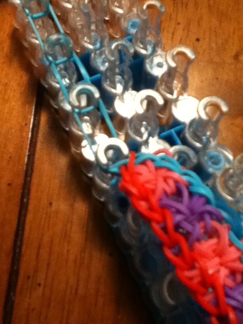 Place it on the first band and pick it all the way up