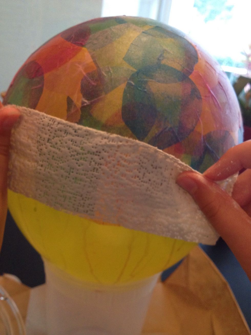 Place it over the hardened colored tissue paper. Overlap strips as you did with the tissue paper.