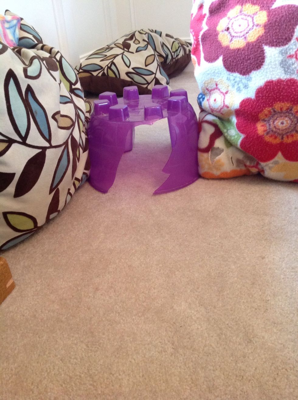 Place it where the entrance/exit will be between two pillows.