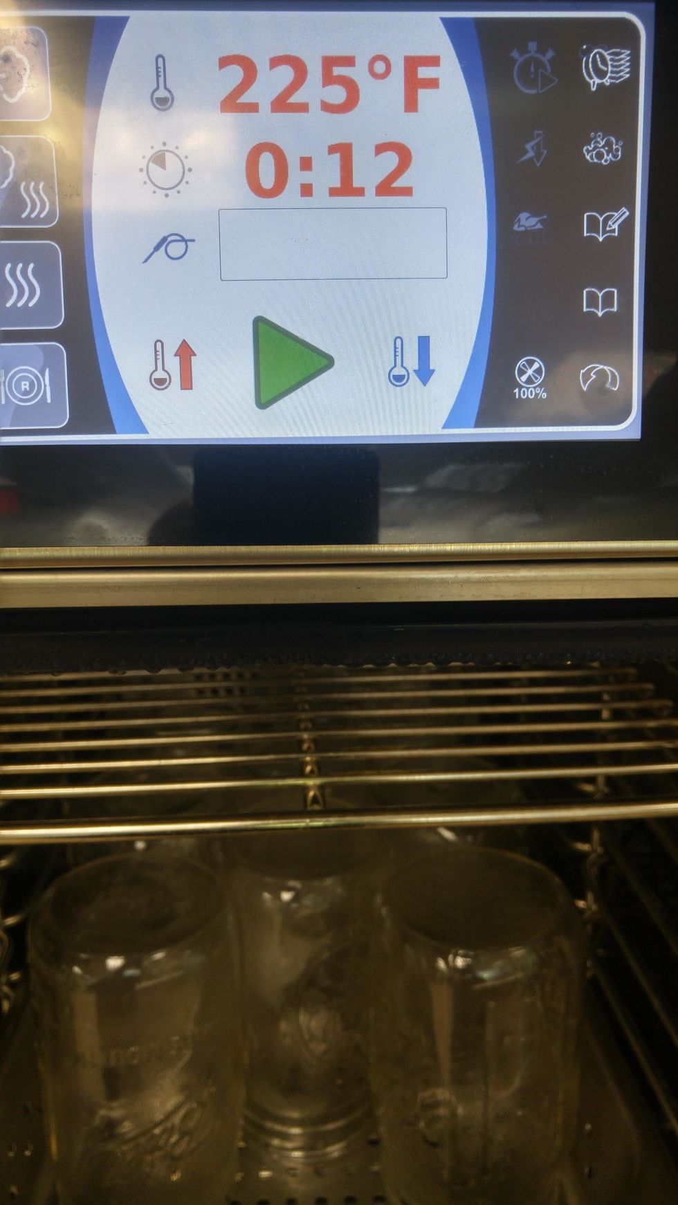 place jars upside down in perforated pan, place lids and rings in pan and steam at 225 for 12 minutes.