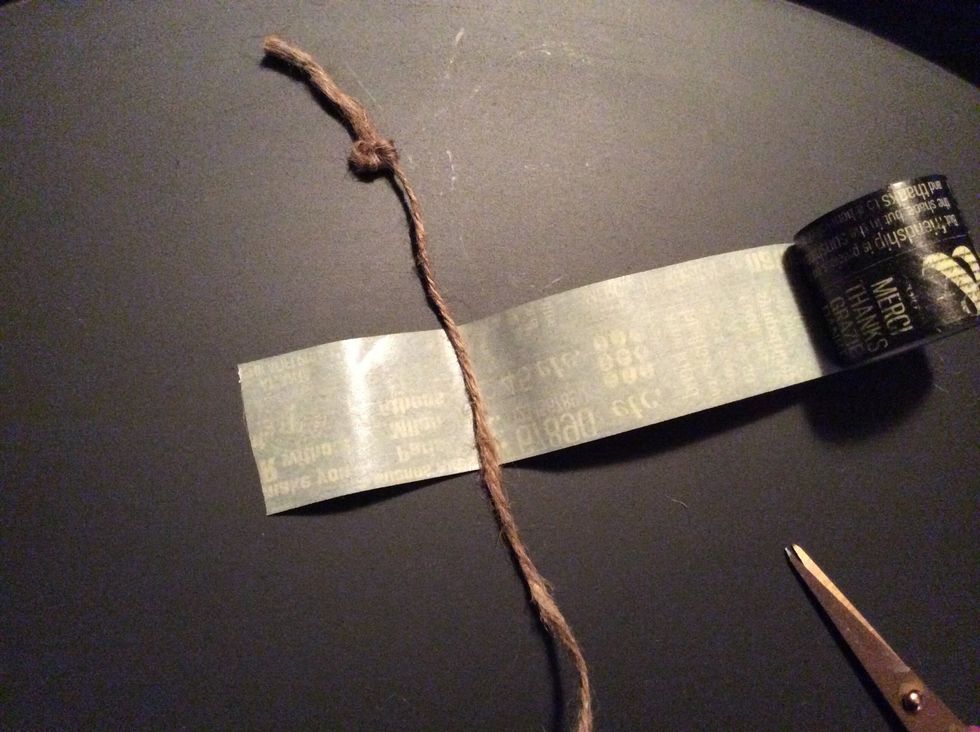 Place jute on sticky side of washi tape.