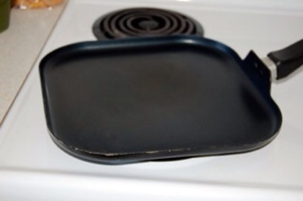 Place large sized skillet on medium heated stove and add sunflower oil.