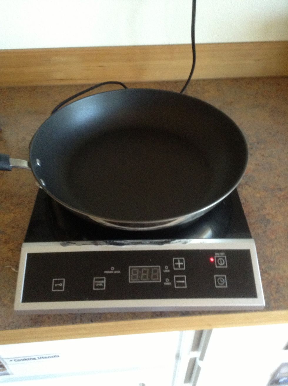 Place large skillet on burner.