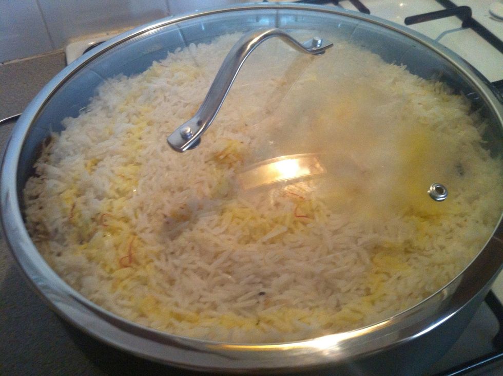 Place lid and cook for 30 minutes on medium heat.Keep an eye to ensure it does catch at the bottom of the pan.Meanwhile peel 2 hard boiled eggs.Once cooked- spoon a layer of rice  to a serving dish