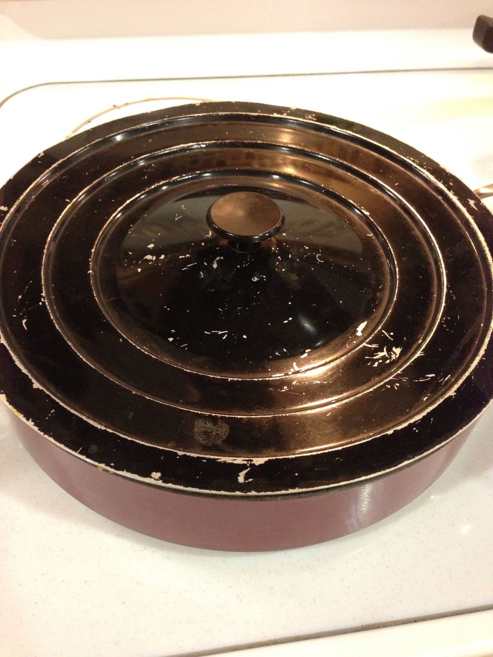 Place lid on pan to keep in the steam