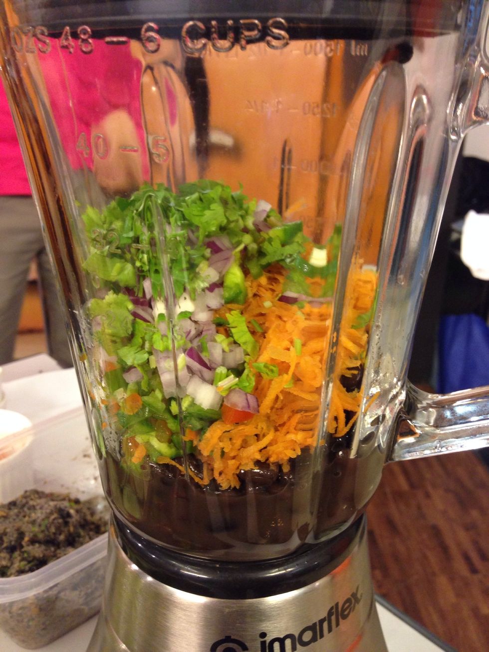 place liquid, beans, carrots, bell pepper, coriander, onions and spices in the blender or food processor process it until smooth and add the powdered rolled oats