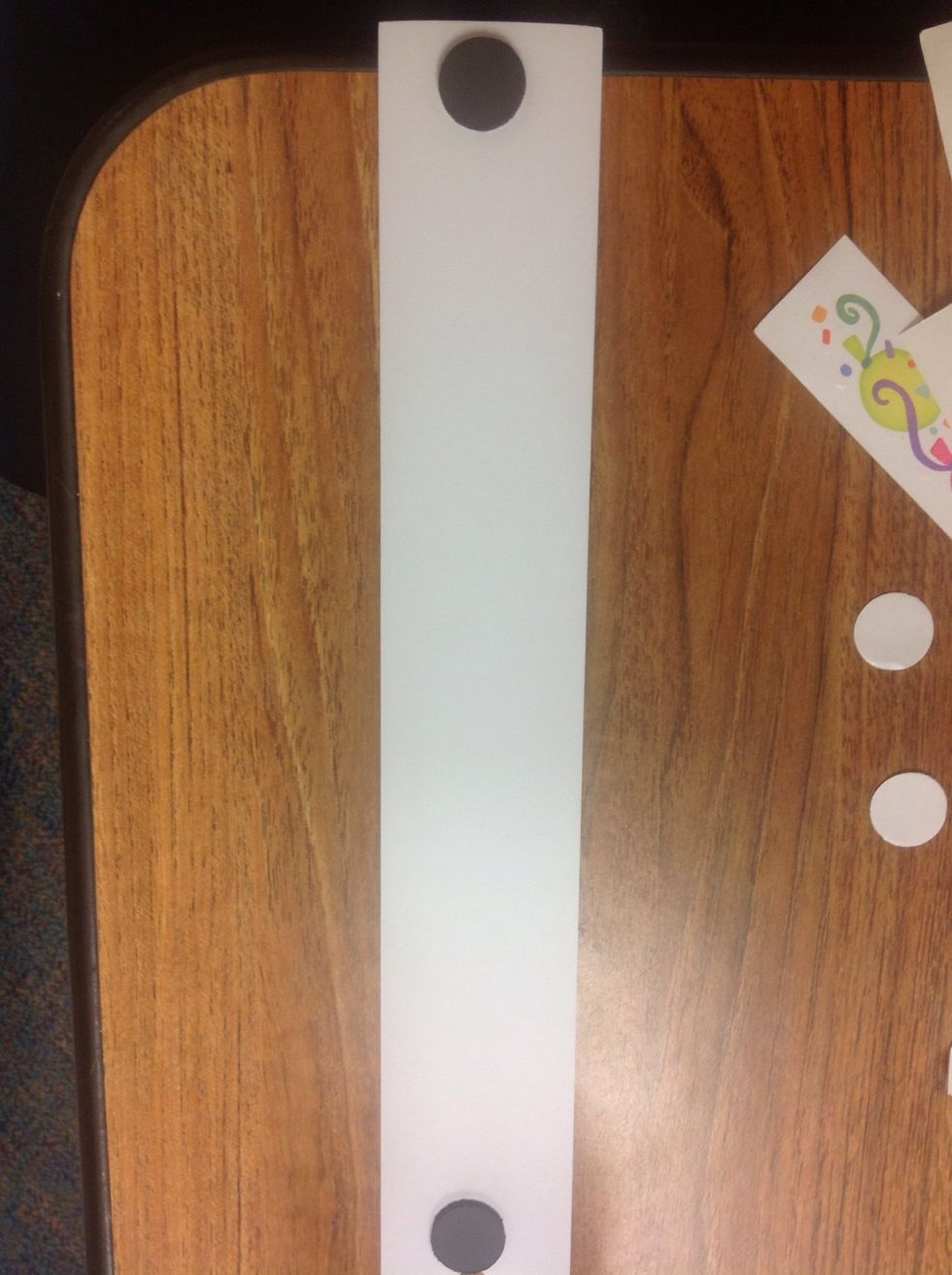 Place magnets on each end of the card stock