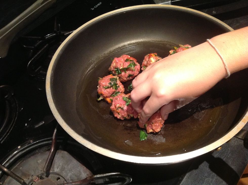Place meatballs in hot oiled frying pan