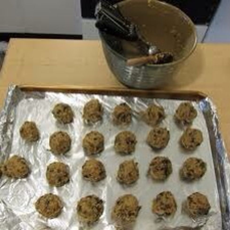 Place meatballs on baking sheet.