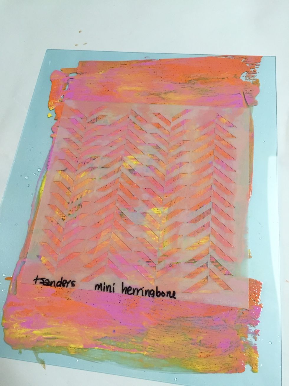 place mini herringbone stencil over inked plate.