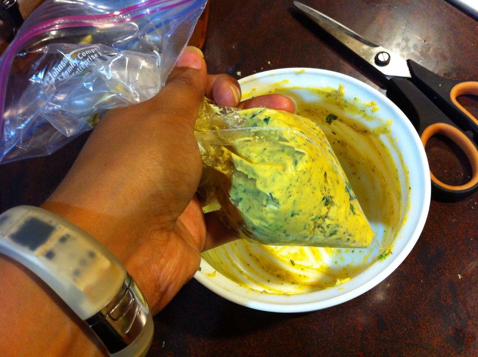 Place mixture in piping bag. Or you can do it the cheap way and use a ziplock bag. Be sure to squeeze the mixture to the corner of the bag. Snip the corner with scissors.