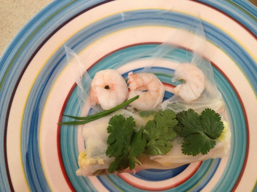 Place more cilantro leaves on top of roll, shrimp on remaining unfolded wrapper, and bean sprouts peeking out the edges, as shown.