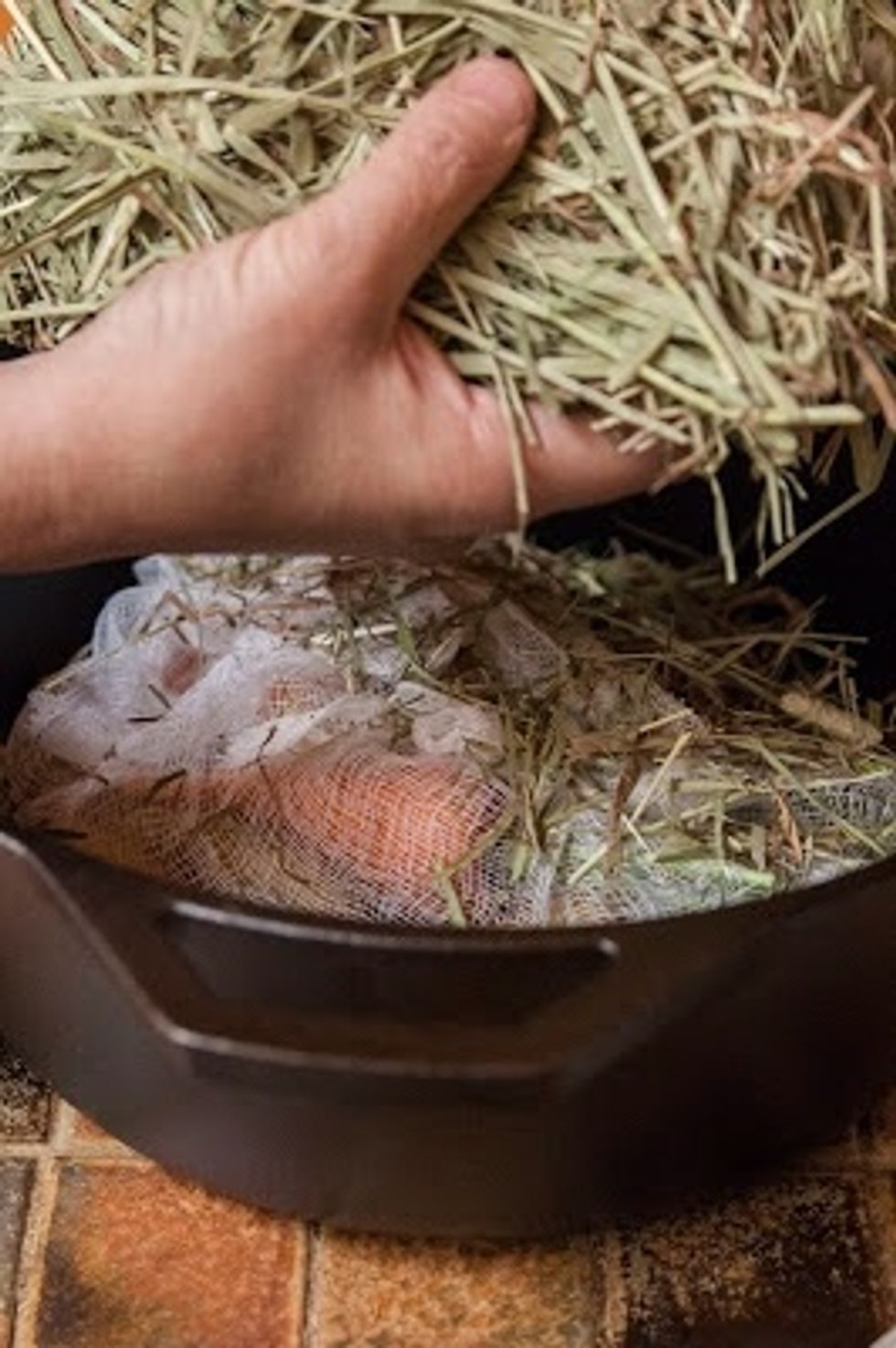 Place more hay on top of the cheesecloth.