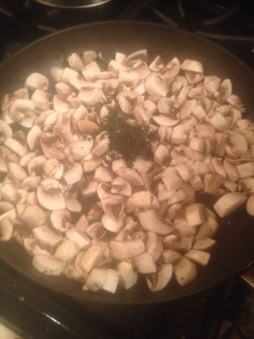 Place mushrooms and Thyme into saut\u00e9 pan over high heat
