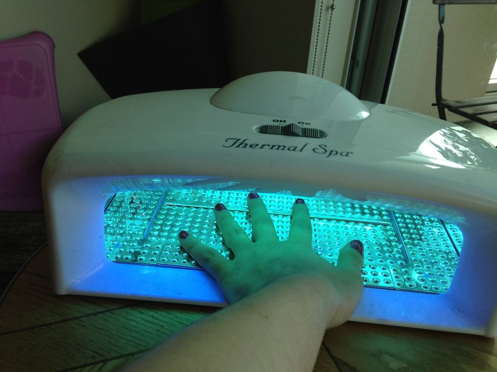 Place nails under UV light for 3 minutes (times vary by light). TIP: try to keep your fingers flat so that the lacquer doesn't harden unevenly.