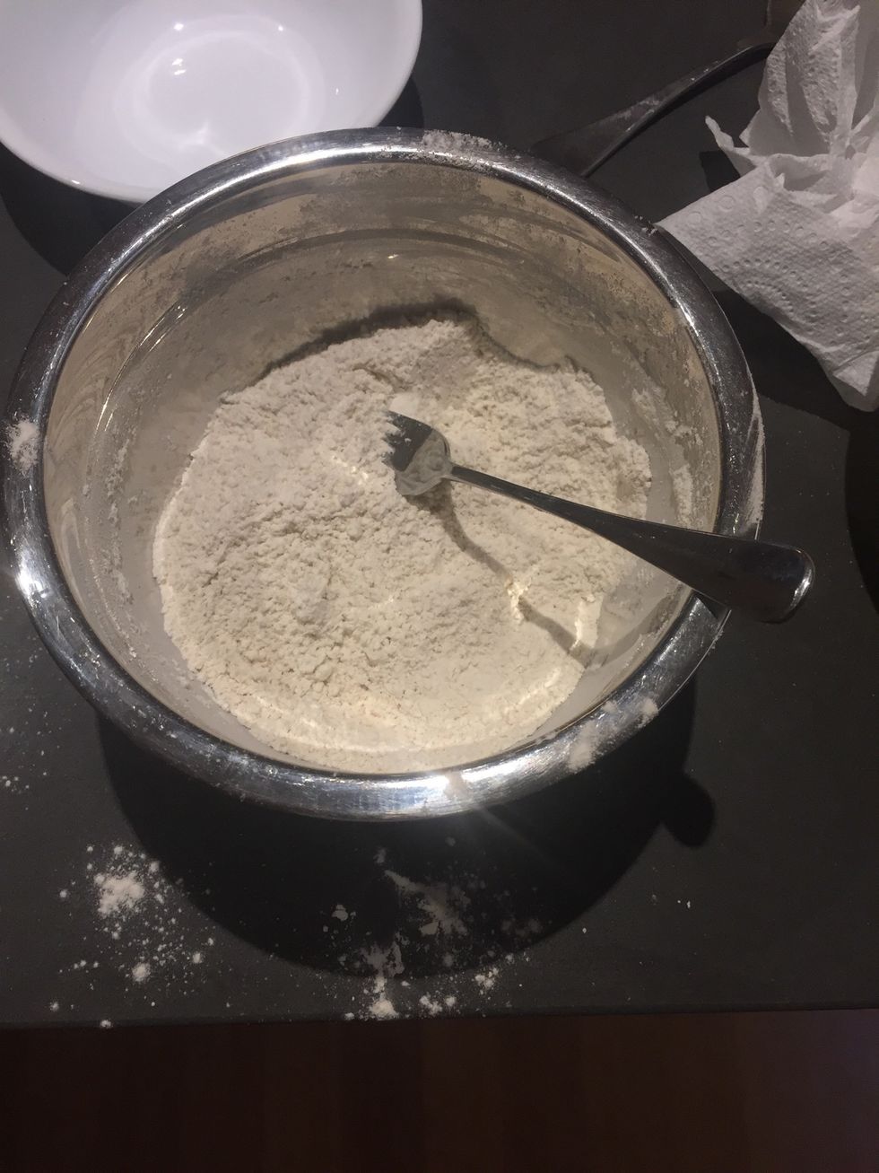 Place oats in a bowl add flour and mix until combined