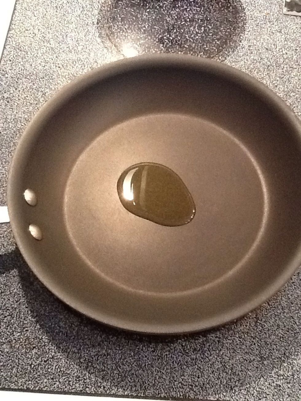 Place oil in pan and heat over medium heat.