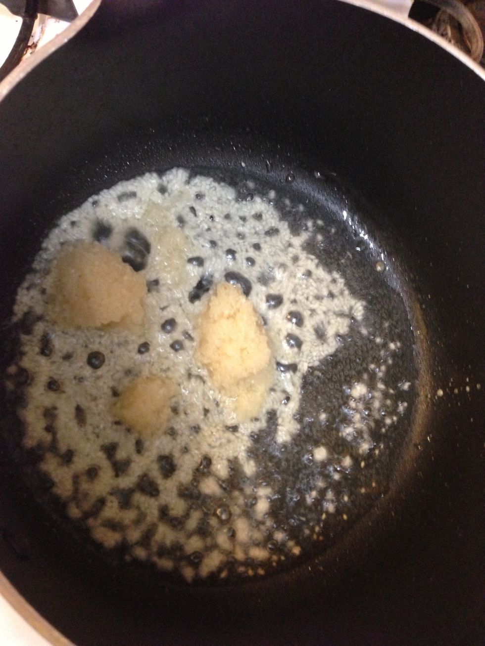 Place oil in the pan, when its hot, add chopped garlic in it.