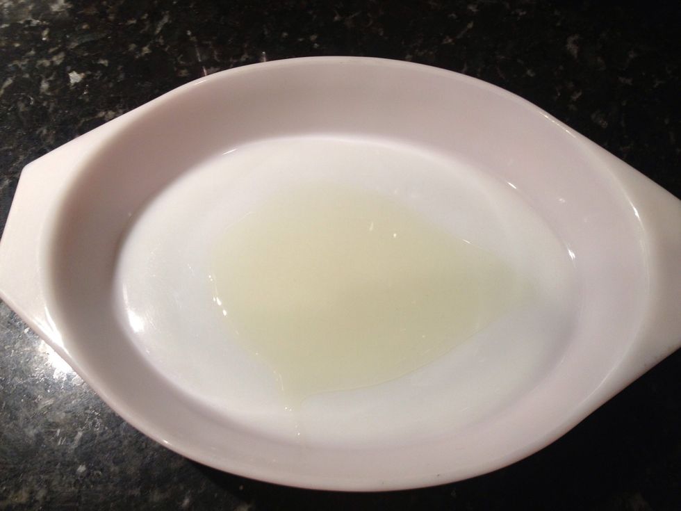 Place olive oil into bottom of baking safe dish.